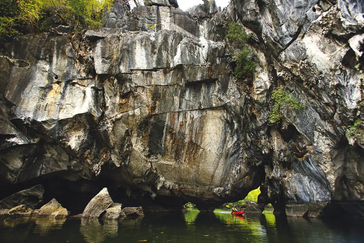 Tham Lod Puyu in Satun, a natural limestone tunnel with a tidal canal flowing through mangrove forests