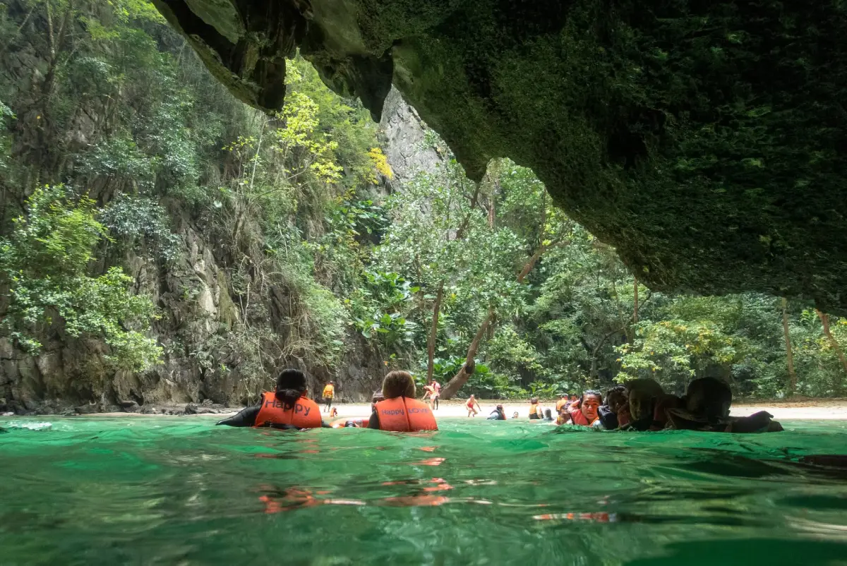 Koh Mook and Emerald Cave in Trang, a hidden beach surrounded by limestone cliffs in the Andaman Sea