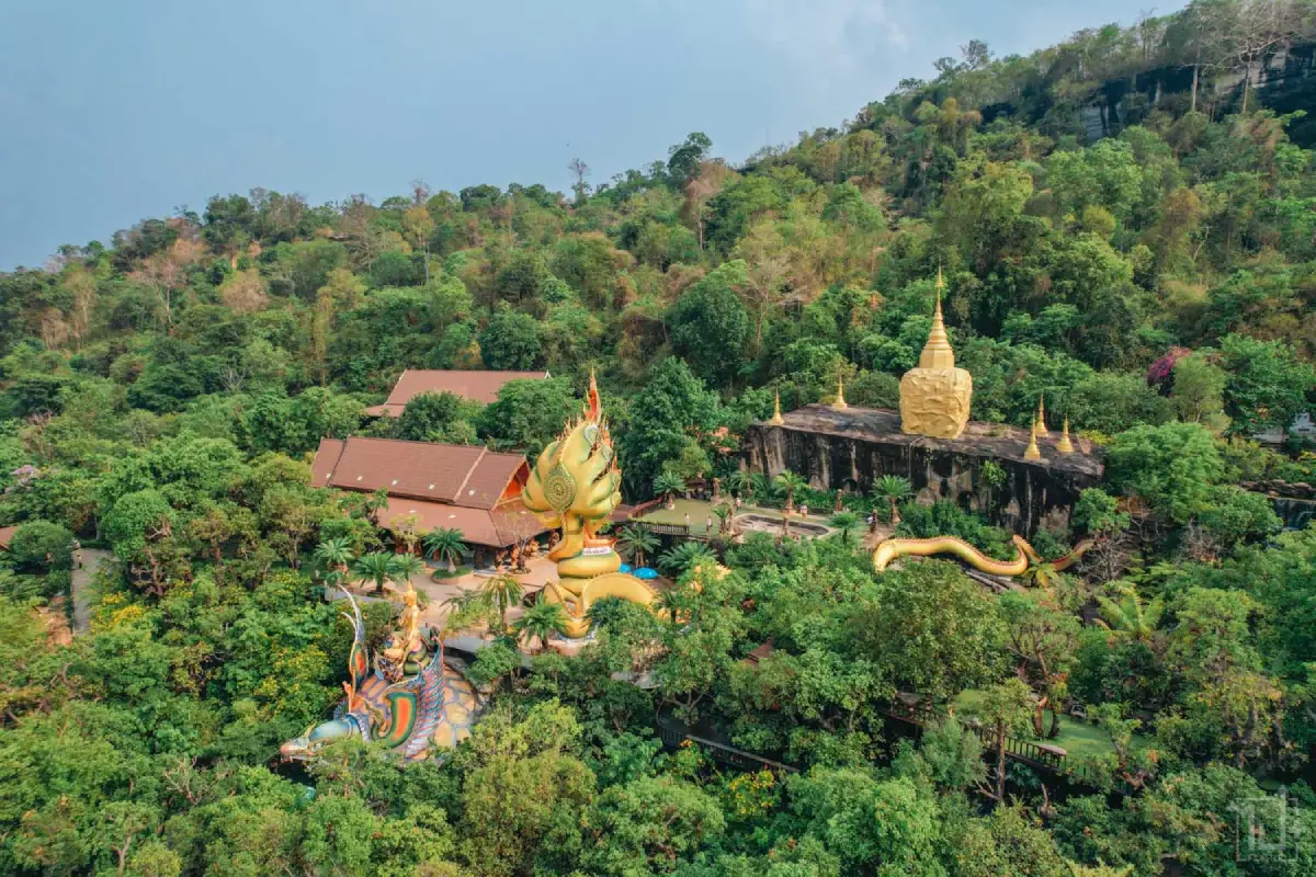 Wat Tham Pha Daen, Sakon Nakhon, Buddhist rock carvings in a mountain landscape