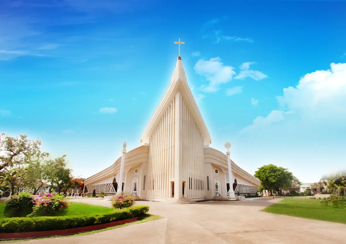 Cathedral of the Archangel Michael in Tha Rae, Sakon Nakhon, featuring distinctive white boat-shaped architecture
